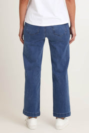 Model Riina wearing size S of the Maddy Wide Leg Jean in colour Denim (Blue), from the back