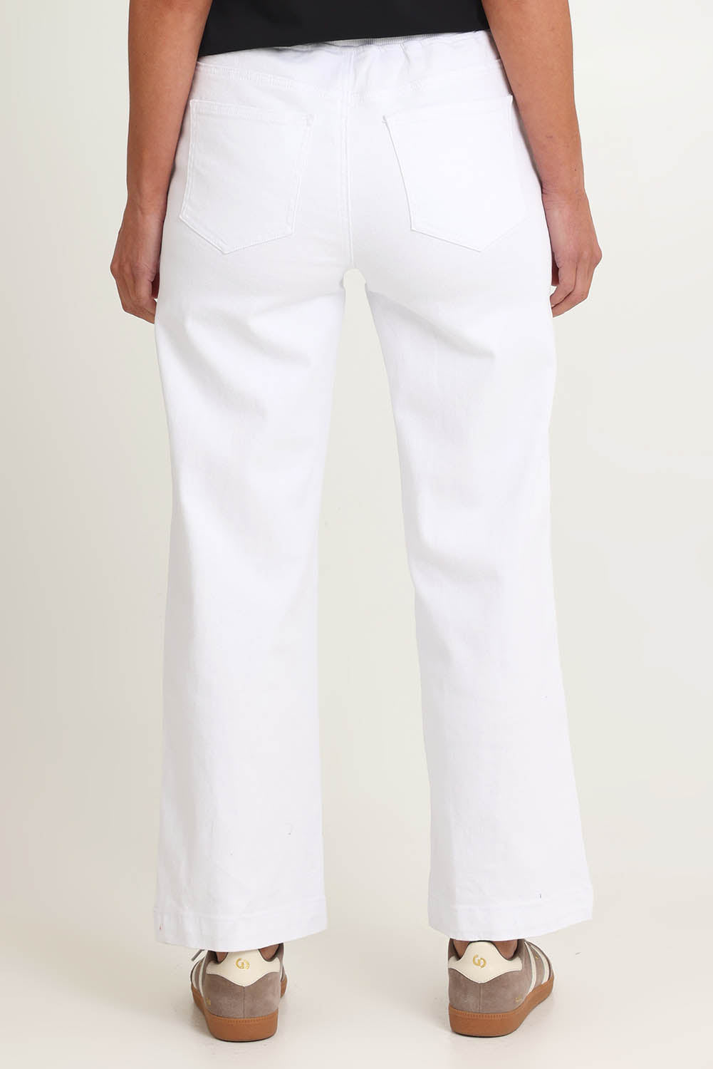 Model Riina wearing size S of the Maddy Wide Leg Jean in colour White (White), from the back