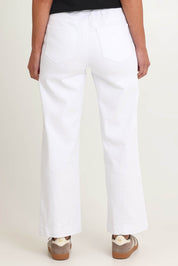 Model Riina wearing size S of the Maddy Wide Leg Jean in colour White (White), from the back