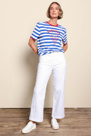Model Riinar wearing size 10 of the Maddy Wide Leg Jean - White in colour White, from the front