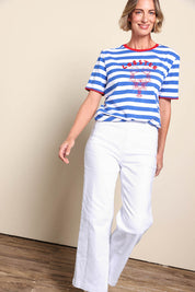 Model Riinar wearing size 10 of the Maddy Wide Leg Jean - White in colour White, from the front