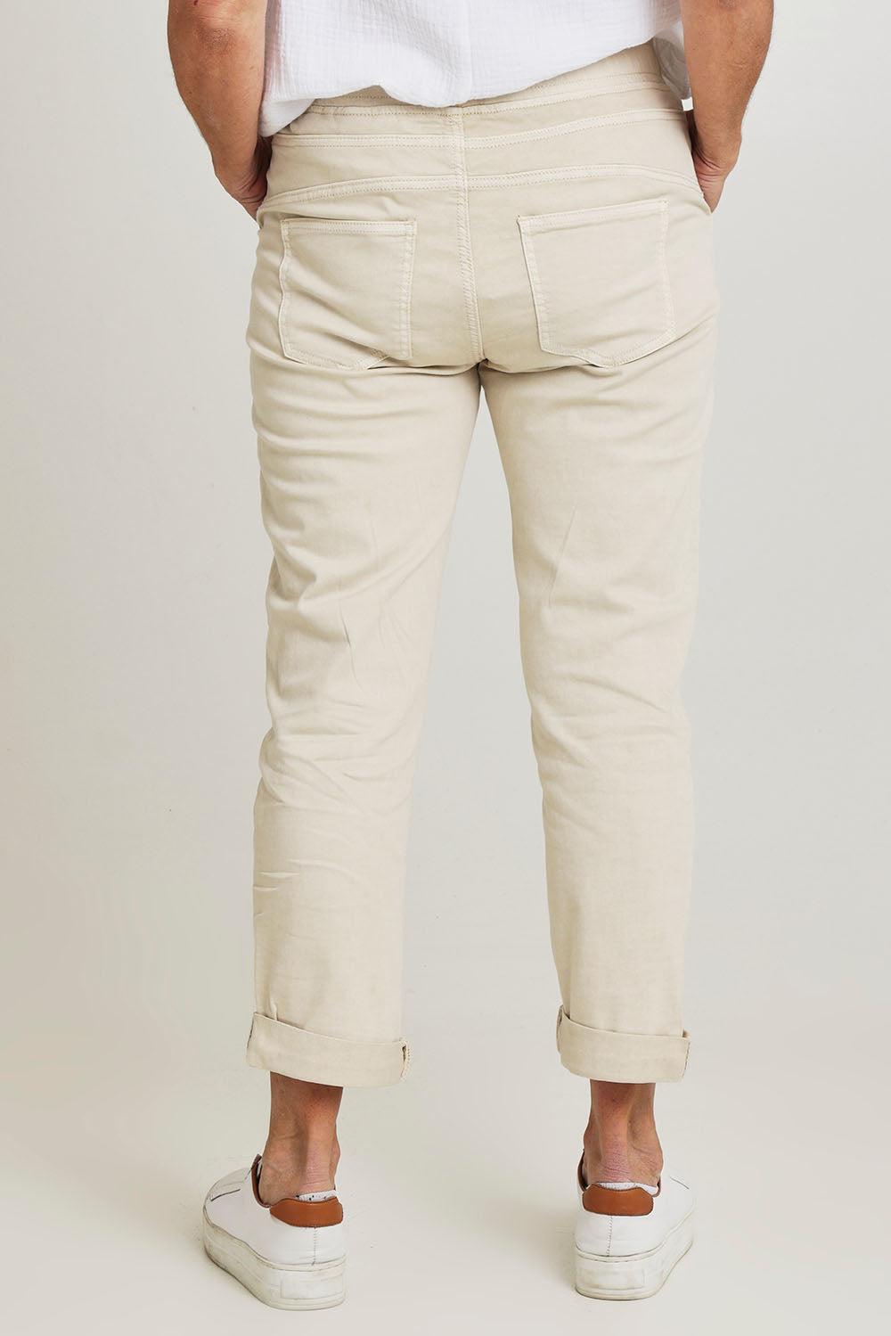 Model Sandy wearing size S of the Isabella Cotton Pant in colour Natural, from the back