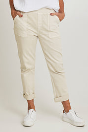 Model Sandy wearing size S of the Isabella Cotton Pant in colour Natural, from the front, cropped image