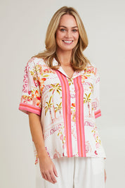 Model Grace wearing size S of the Ciao Bella Shirt in colour Pink (Pink), from the front, cropped image