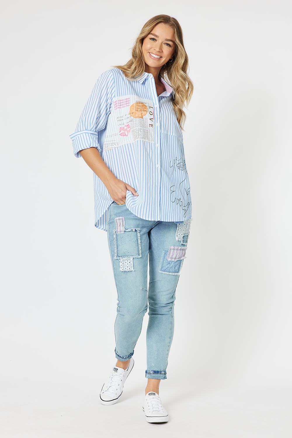 A model wearing the Love Me Stripe Cotton Shirt in colour Blue (Blue), from the front, showing the whole outfit