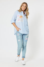 A model wearing the Love Me Stripe Cotton Shirt in colour Blue (Blue), from the front, showing the whole outfit