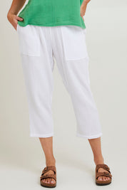 Model Grace wearing size S of the Byron Cotton 7/8 Pant in colour White (White), from the front, cropped image