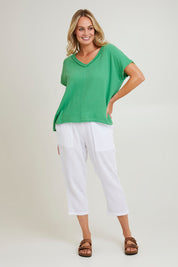 Model Grace wearing size S of the Byron Cotton 7/8 Pant in colour White (White), from the front, showing the whole outfit