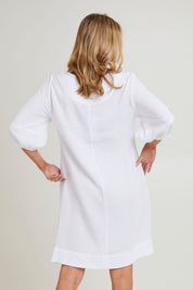 Model Grace wearing size S of the Byron Cotton Dress in colour White (White), from the back