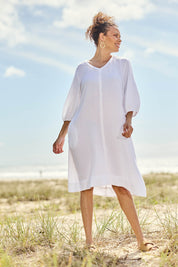 Model Lala wearing size S of the Byron Cotton Dress in colour White (White), from the front, showing the whole outfit