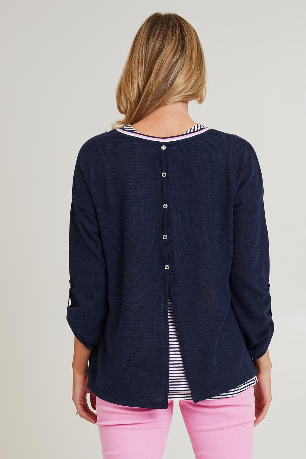 Model Grace wearing size S of the C'est La Vie 2 In 1 in colour Navy (Blue), from the back