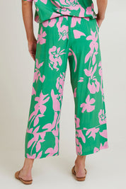 Model Grace wearing size S of the Spring Pant in colour Emerald (Green), from the back