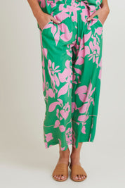 Model Grace wearing size S of the Spring Pant in colour Emerald (Green), from the front, cropped image