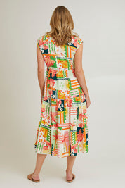 Model Grace wearing size S of the Cancun Dress in colour Multi (Green), from the back