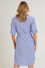 Model Grace wearing size S of the Get Shirty Cotton Stripe Dress in colour Blue (Blue), from the back