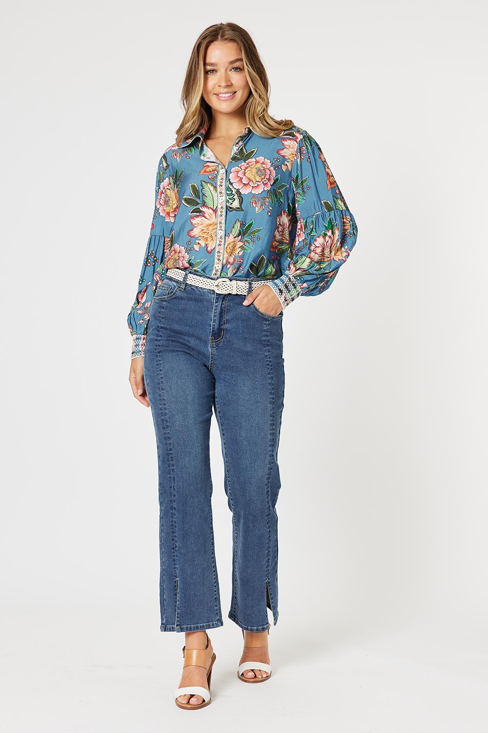 A model wearing the Vintage Rose Shirt in colour Multi (Blue), from the front, showing the whole outfit