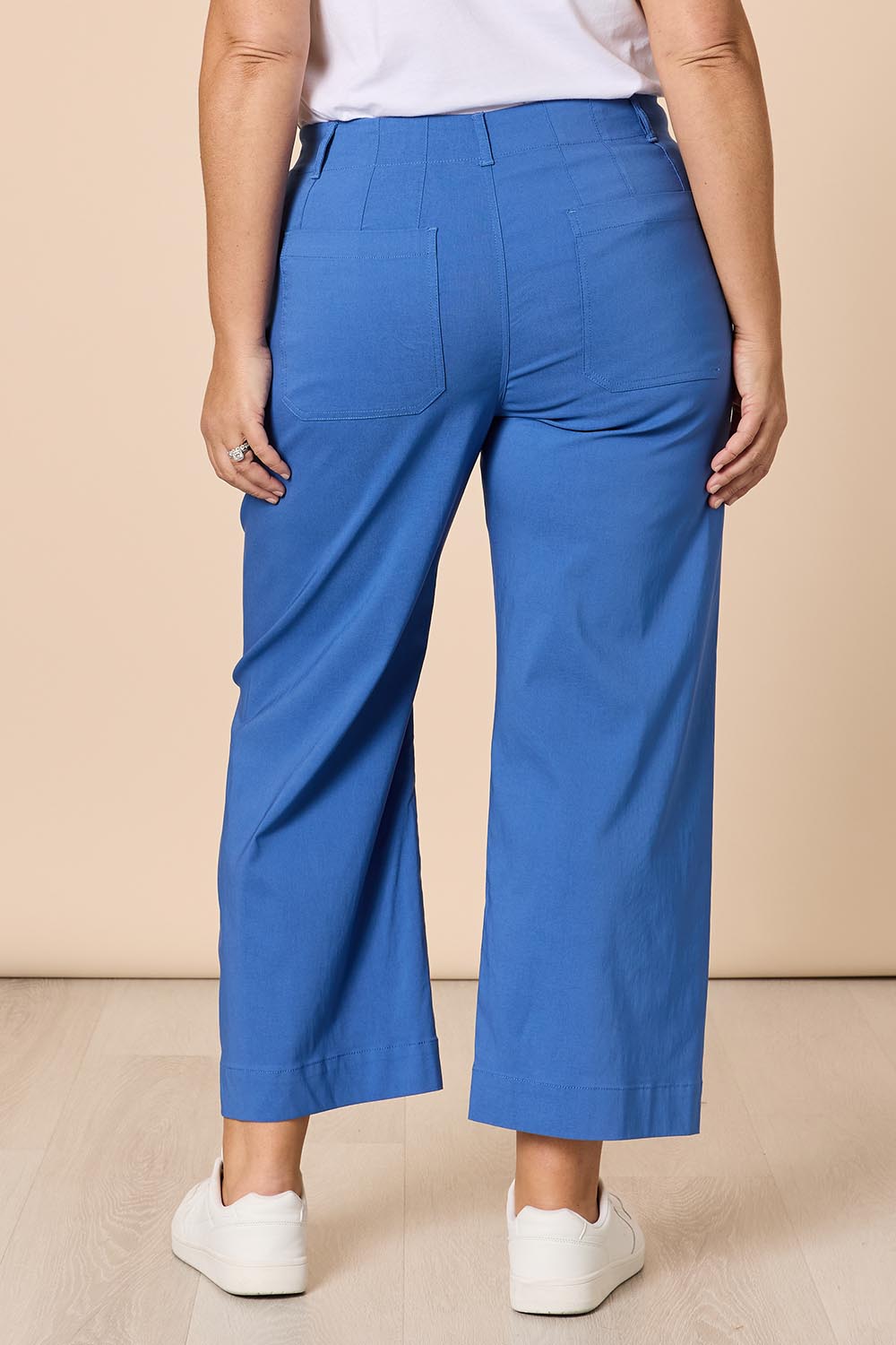 A model wearing The Marine Wide Leg Pant in colour Blue (Blue), from the back