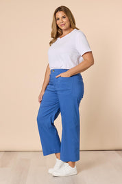 A model wearing The Marine Wide Leg Pant in colour Blue (Blue), from the front, showing the whole outfit