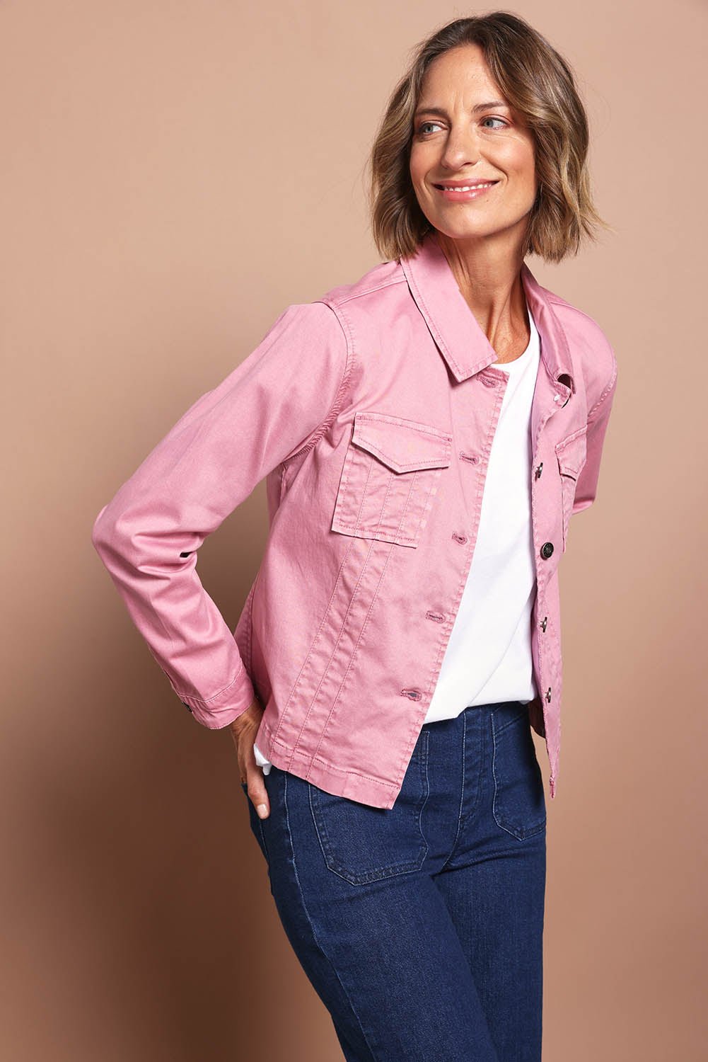Model Riina wearing size S of the Retro Denim Jacket in colour Pink (Pink), from the front, cropped image