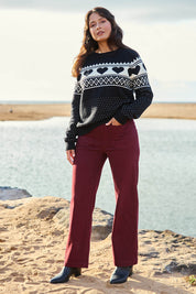 Model Tahnee wearing size S of the Carpenter Wide Leg Jean in colour Shiraz (Red), from the front, showing the whole outfit
