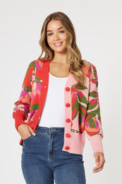 A model wearing the Bloom Cardigan in colour Pinkmulti (Pink), from the front, cropped image