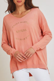 Model Madeline wearing size S of the Saint Barth Knit in colour Coral (Pink), from the front, cropped image