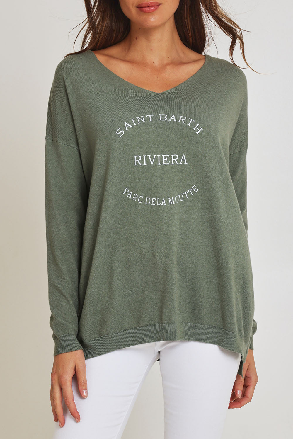 Model Madeline wearing size S of the Saint Barth Knit in colour Khaki (Green), from the front, cropped image