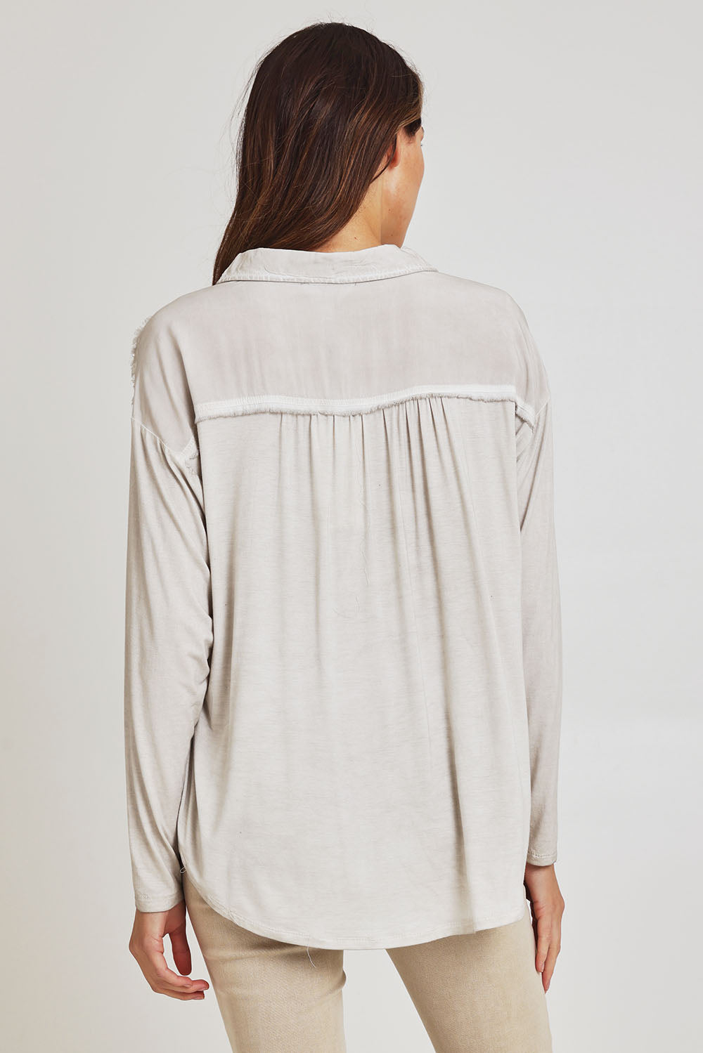 Model Madeline wearing size S of the Paige Garment Washed Shirt in colour Natural, from the back