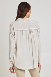 Model Madeline wearing size S of the Paige Garment Washed Shirt in colour Natural, from the back
