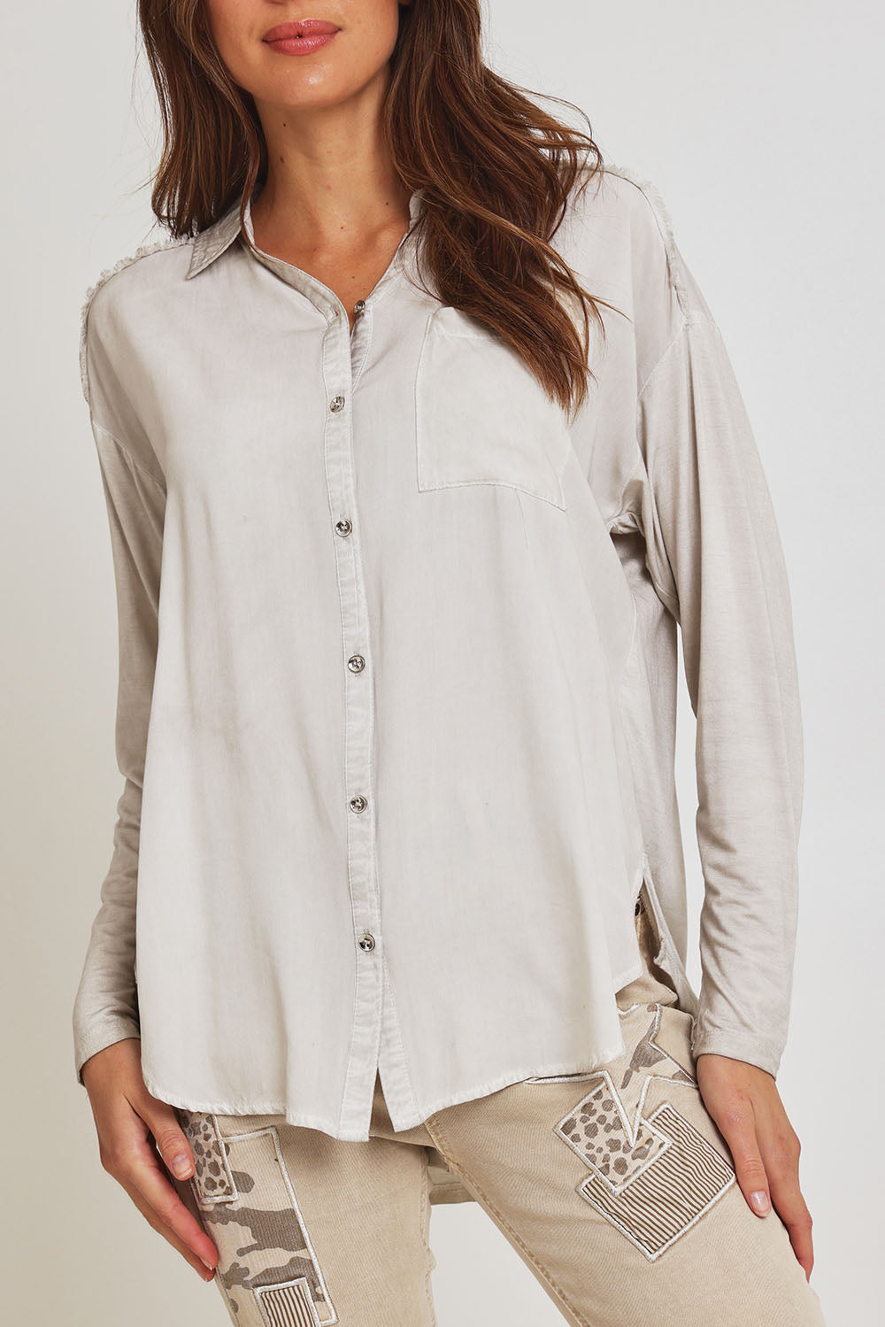 Model Madeline wearing size S of the Paige Garment Washed Shirt in colour Natural, from the front, cropped image