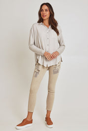 Model Madeline wearing size S of the Paige Garment Washed Shirt in colour Natural, from the front, showing the whole outfit