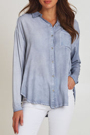 Model Madeline wearing size S of the Paige Garment Washed Shirt in colour Washblue (Blue), from the front, cropped image