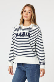 A model wearing the Paris Stripe Sweatshirt in colour Navy (Blue), from the front, cropped image