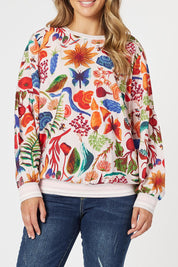 A model wearing the Rio Top in colour Multi (Pink), from the front, cropped image