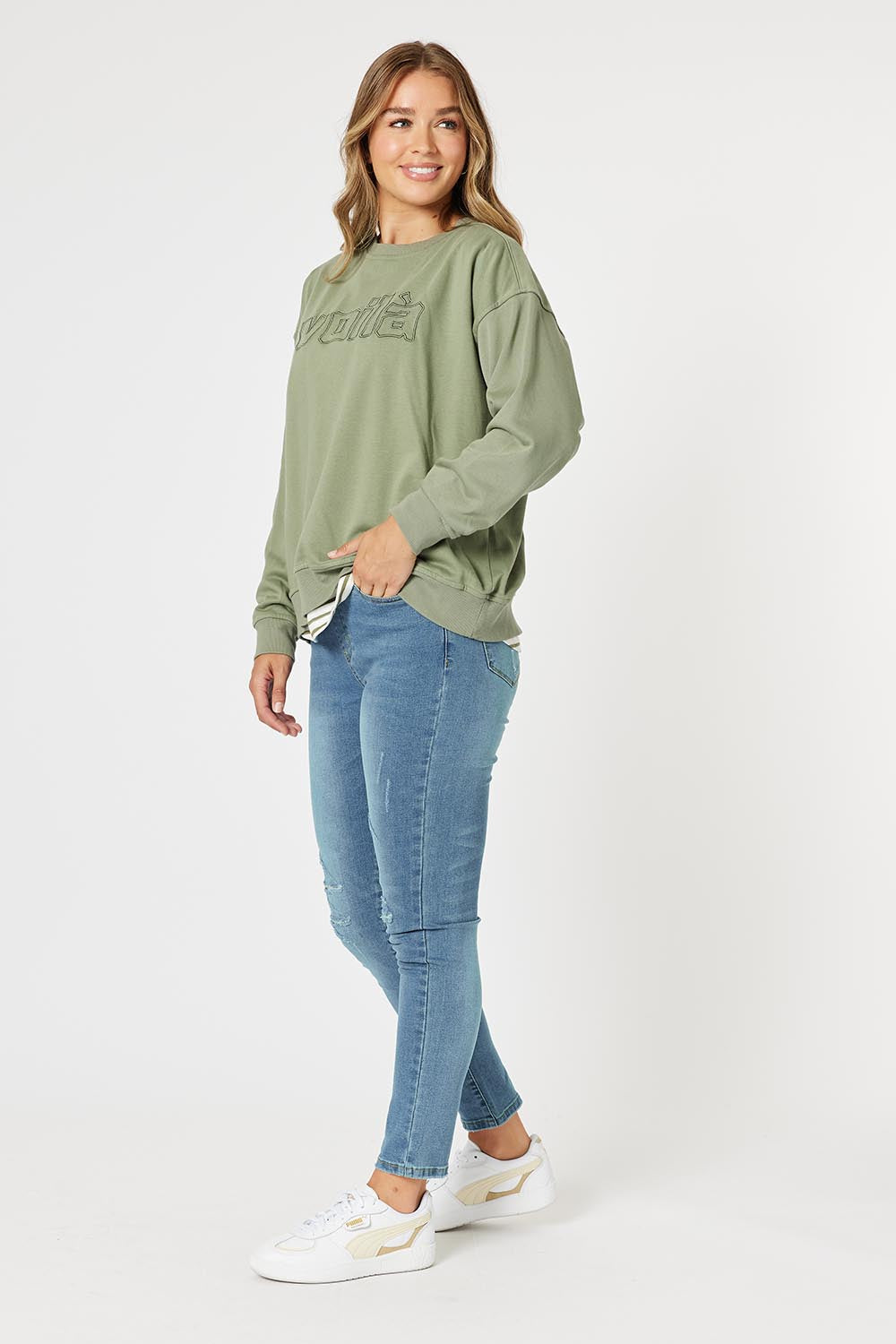 A model wearing the Voila Cotton Blend Sweat in colour Khaki (Green), from the front, showing the whole outfit