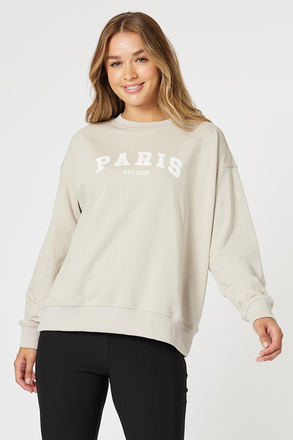 A model wearing the Paris Cotton Blend Sweat in colour Stone, from the front, cropped image