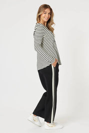 A model wearing the Urban Pant in colour Black (Black), from the front, showing the whole outfit