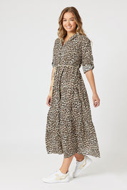A model wearing the Le Marais Cotton Dress in colour Animal, from the front, showing the whole outfit