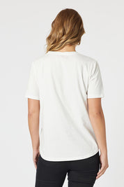 A model wearing the Caffe Cotton Tin colourShirt - Ivory (White), from the back