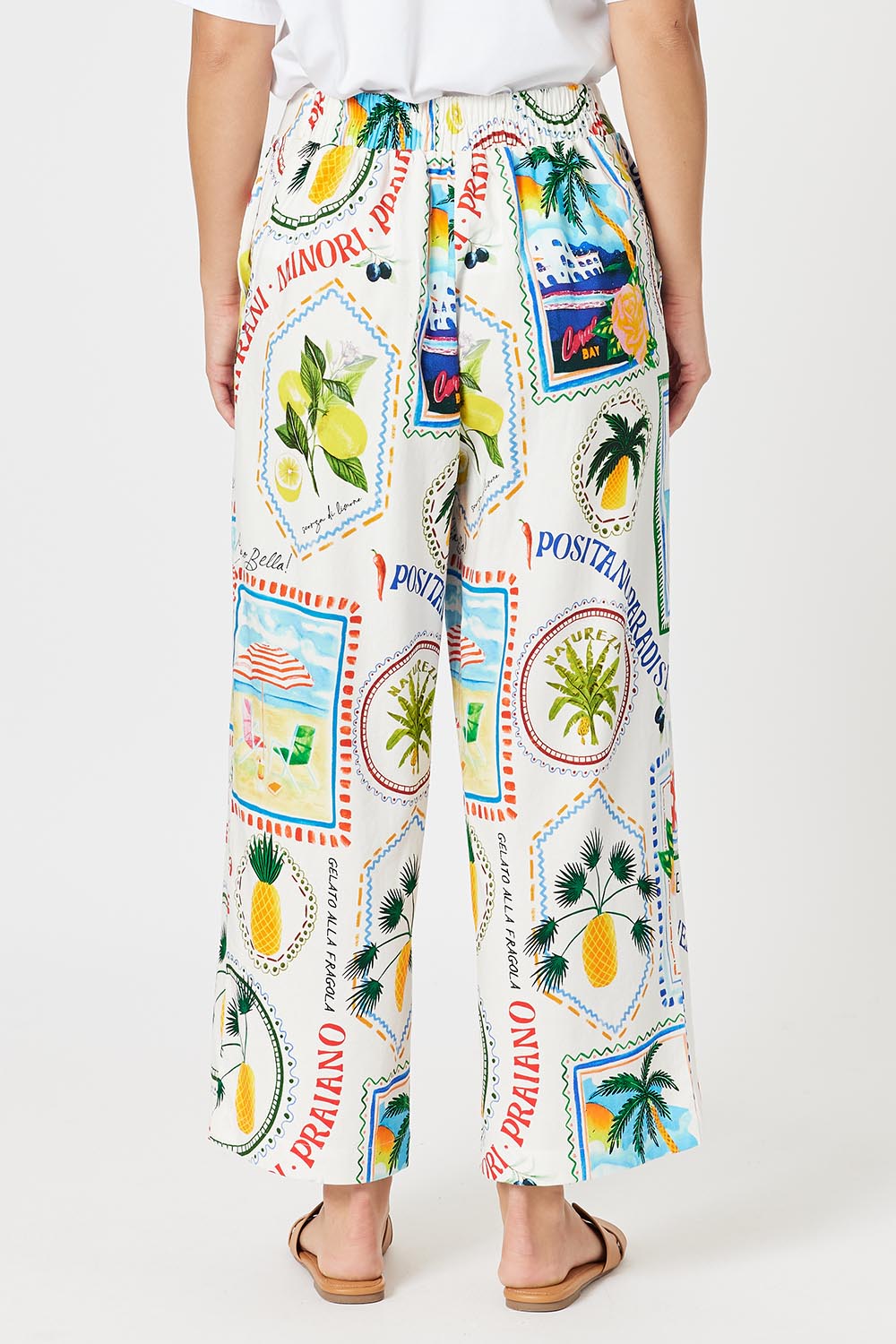 A model wearing the Amalfi Linen Blend Pant in colour Blue, from the back