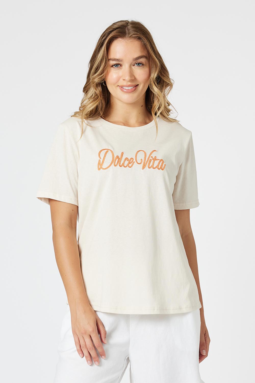 A model wearing the Dolce Vita Cotton Blend Tee in colour Natural, from the front, cropped image