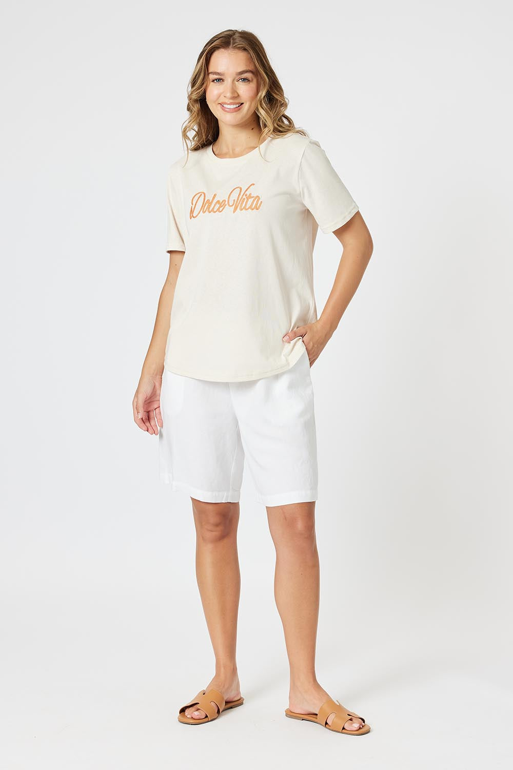 A model wearing the Dolce Vita Cotton Blend Tee in colour Natural, from the front, showing the whole outfit