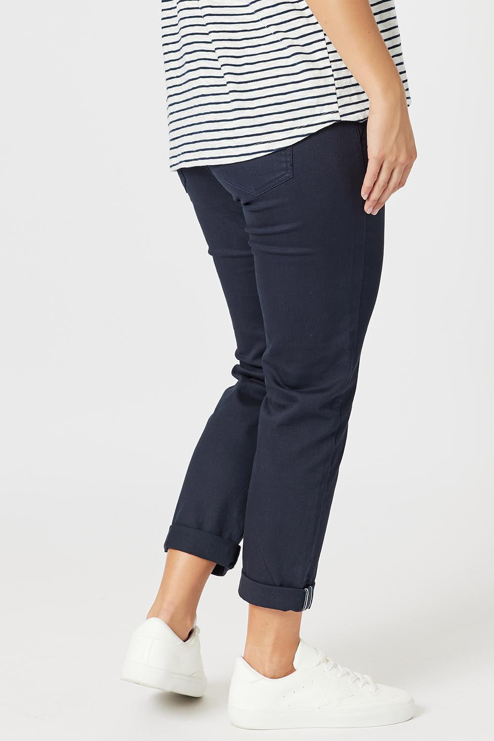 A model wearing the Isabella Cotton Pant in colour Navy (Blue), from the back