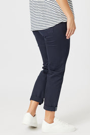 A model wearing the Isabella Cotton Pant in colour Navy (Blue), from the back