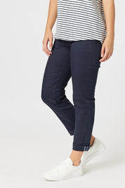 A model wearing the Isabella Cotton Pant in colour Navy (Blue), from the front, cropped image