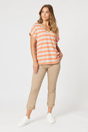 A model wearing the Isabella Cotton Pant in colour Nutmeg, from the front, showing the whole outfit