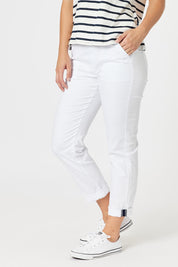 A model wearing the Isabella Cotton Pant in colour White (White), from the front, cropped image
