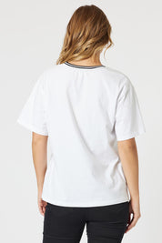 A model wearing the Le Marais Cotton Tee in colour White (White), from the back