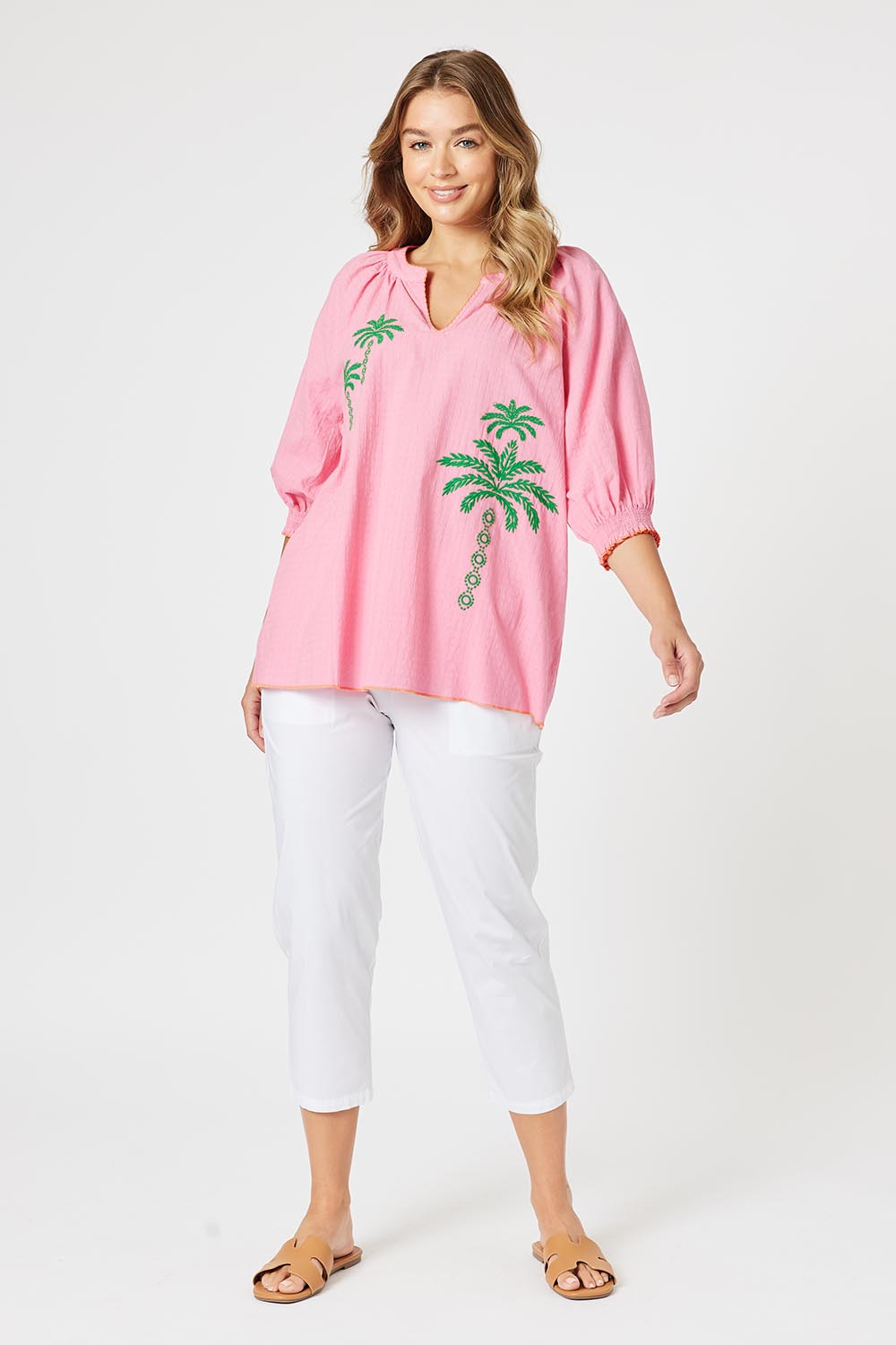 A model wearing the Pina Colada Embroidered Cotton Top in colour Pink (Pink), from the front, showing the whole outfit