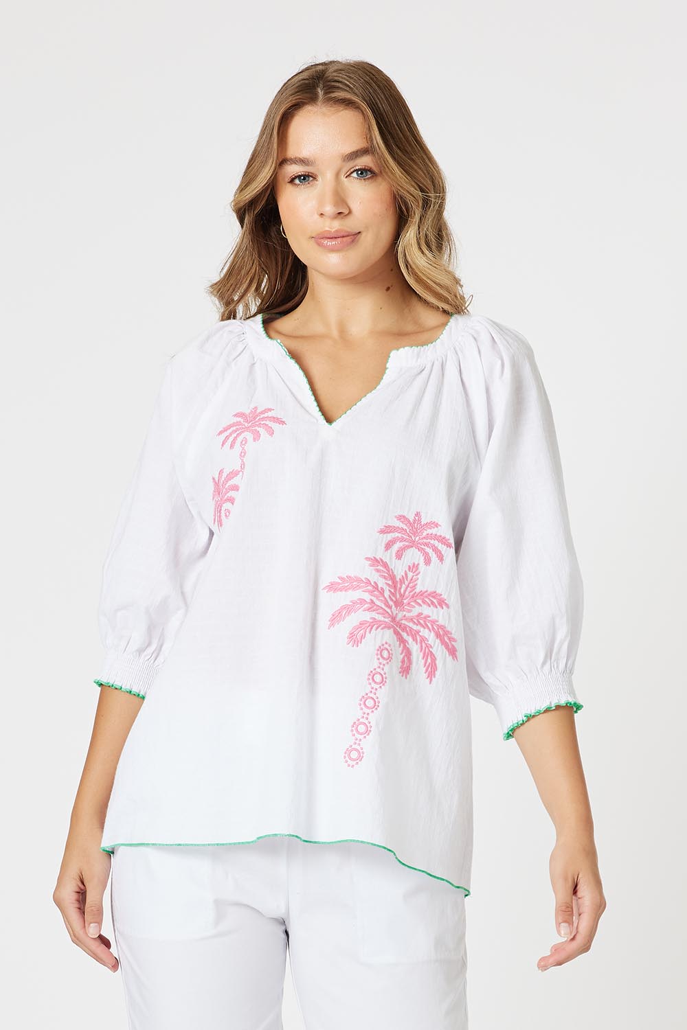 A model wearing the Pina Colada Embroidered Cotton Top in colour White (White), from the front, cropped image